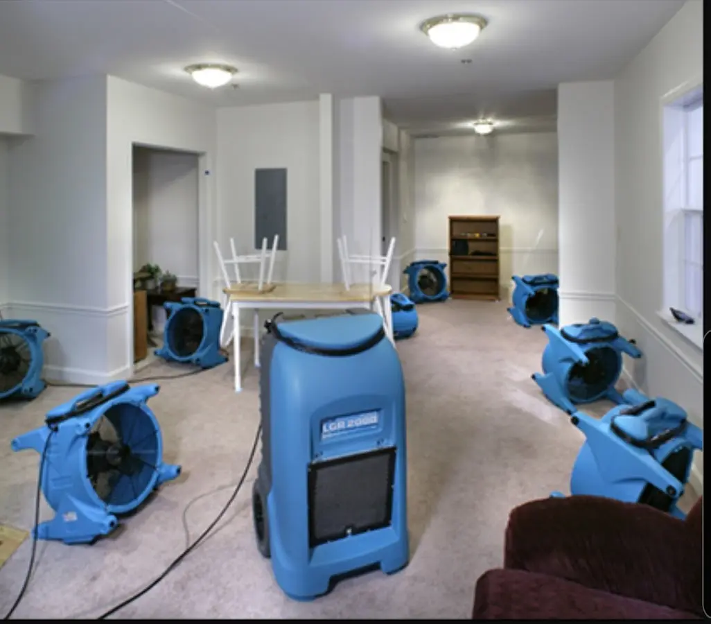 Air movers and dehumidifier setup for Water Damage Restoration in Elma